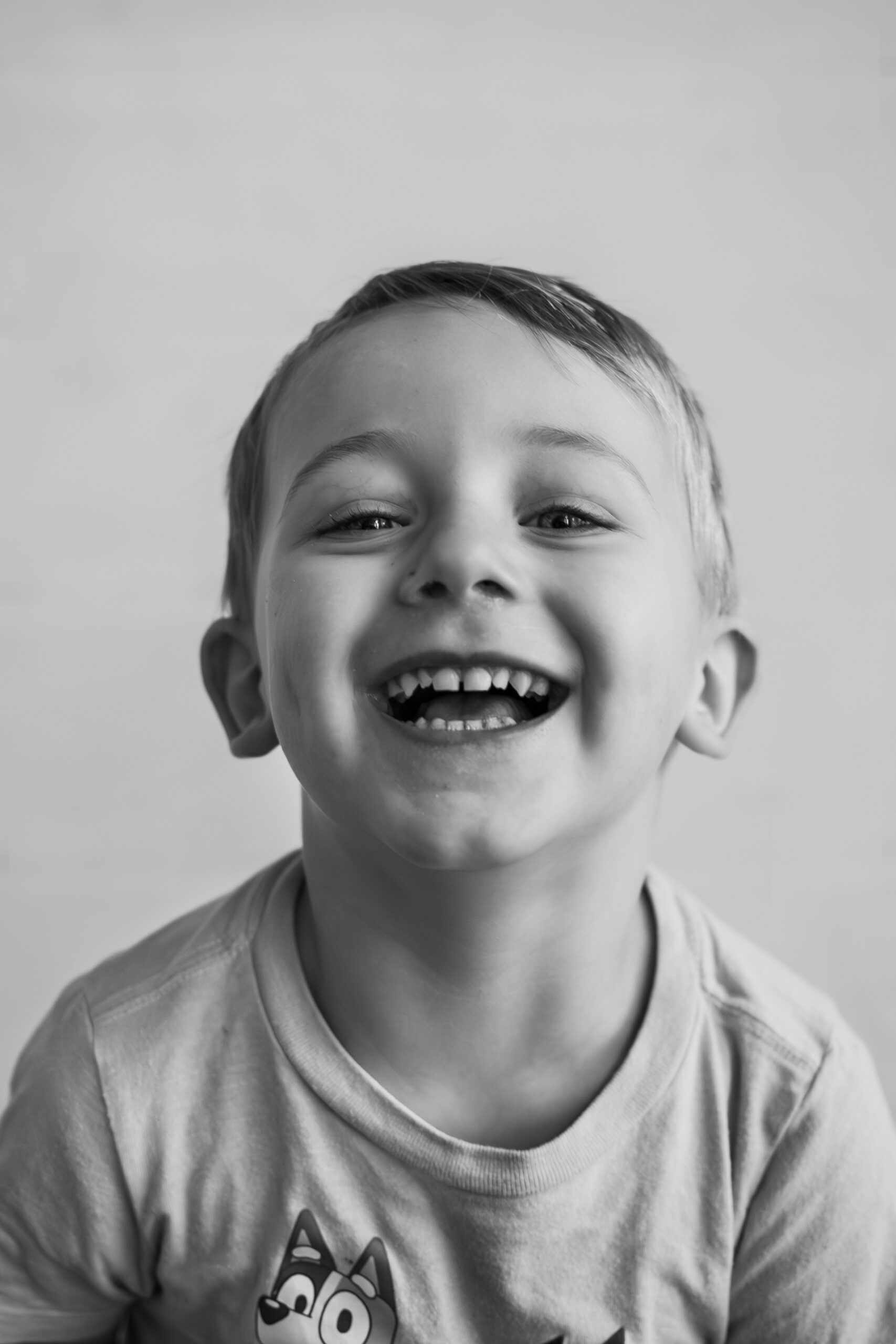 smiling toddler for summer mini session capturing his personality